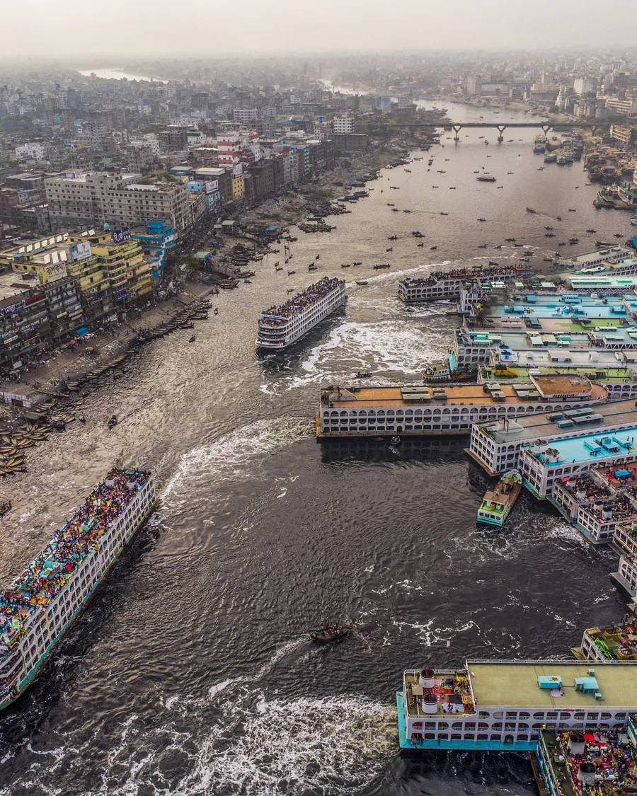 Launches crowded together at a river terminal